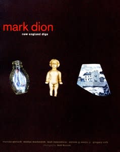 Exhibition catalogue cover. A tiny glass vial, an ivory figuring of a child, and a fragment of blue-and-white china on a dark background. Title text: "mark dion, new england digs"