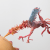 bird sculpture sucking flower
